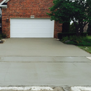 cement concrete driveway installation for a residential home in Brownstown