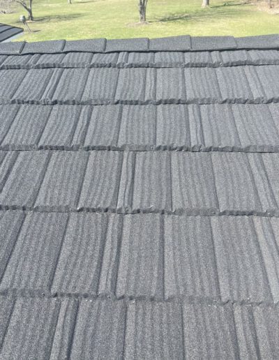 metal roof with black shingles